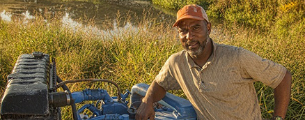 Man posing with tractor